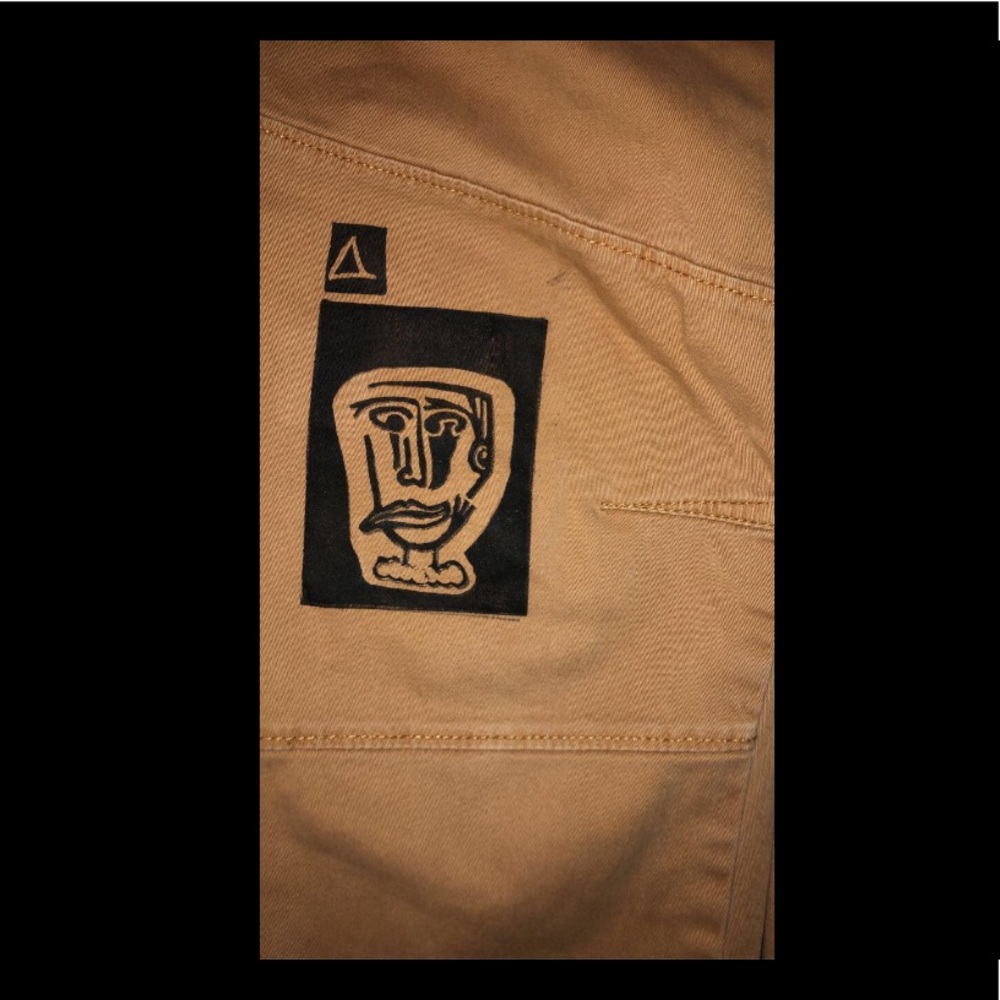 Hand printed/ hand carved, jogger pants with face print.